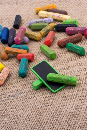 Used crayons of various color and a notice board