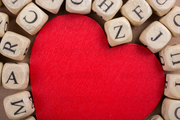 Red Love icon and Letter cubes of made of wood