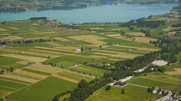 Panorama from the Tegelberg massif to the baroque church of St. Coloman and the Forggensee