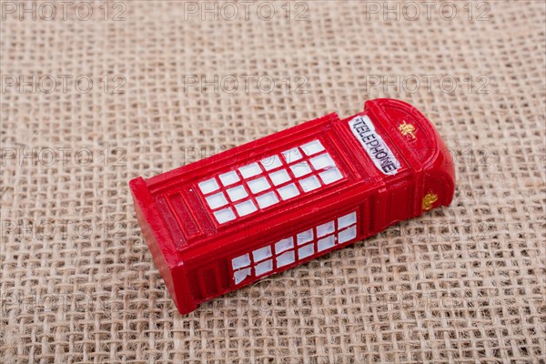 Red color phone booth on a canvas background