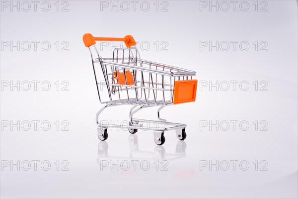 Hand holding a Cart on a white background