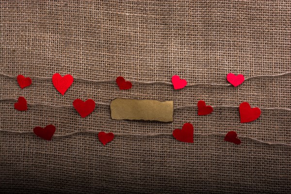 Love concept with note paper heart icons on threads