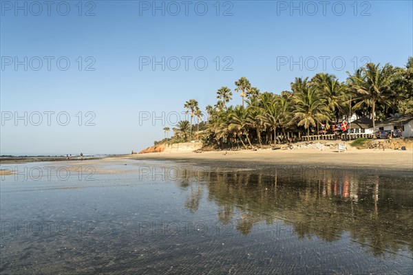 Reflection at low tide on Fajara beach