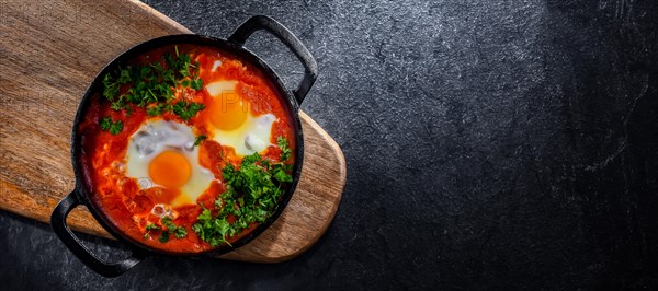 Shakshouka dish in a cast iron pan