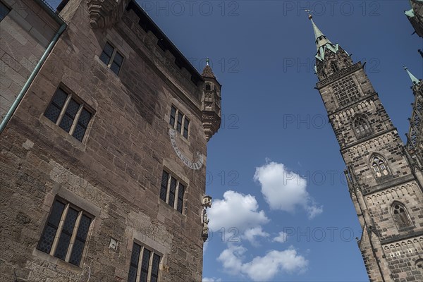 Historic residential tower with sundial and angel sculpture