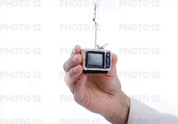 Child holding a tv set n his hand on a white background