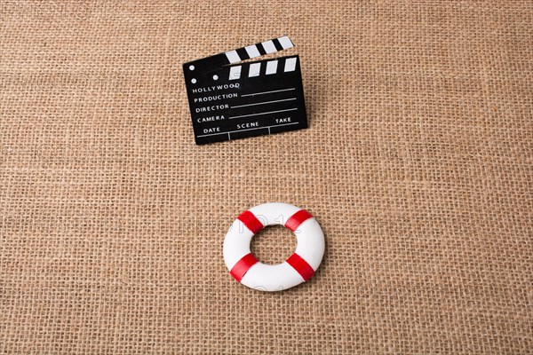 Life preserver and a cinema clapper canvas