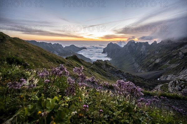 View over Saentis mountains into the valley of Meglisalp at sunrise