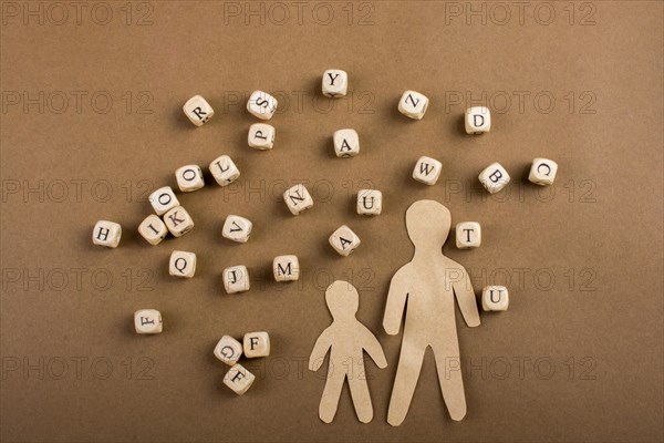 Letter cubes of made of wood and men figurine