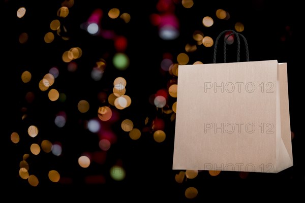 Template. Shopping bag on bokeh background