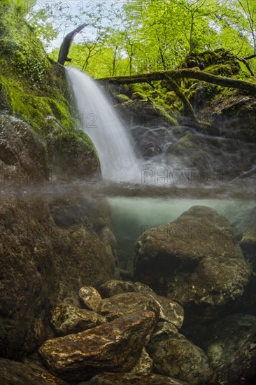 Underwater photograph of a waterfall in the UNESCO World Heritage Beech Forest in the Limestone Alps National Park