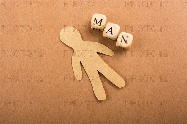 Paper man and man wording with letter cubes on paper