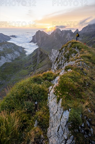 Mountaineer at sunrise on the Rotstein Pass