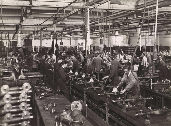 Wolseley factory interior with workers at machinery