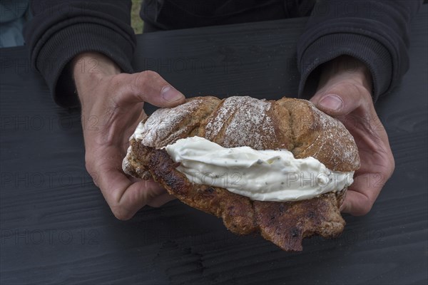 Grilled pork steak with curd cheese in a roll