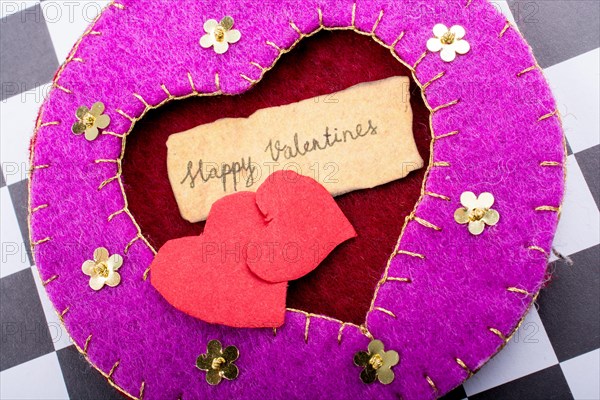 Love icon and Valentine's day wording on torn paper