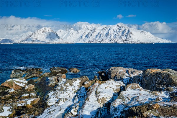 Lofoten islands and Norwegian sea in winter with snow covered mountains. Lofoten islands