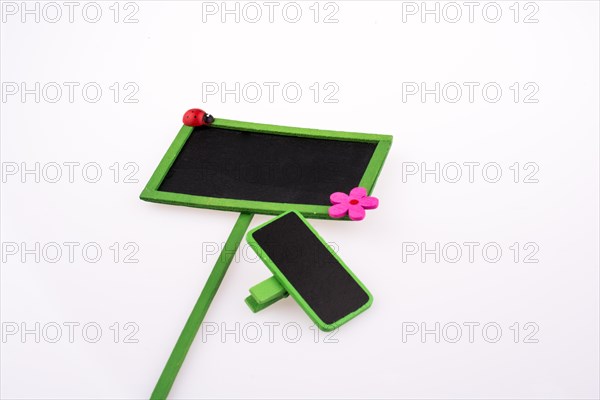 Green framed signboards with a flower and ladybug on a white background