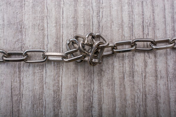 Chain made of silver color metal on grey background