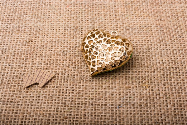 Heart shaped object with an arrow on canvas