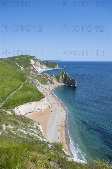 View over the chalk coast with the famous rock bridge Durdledoor