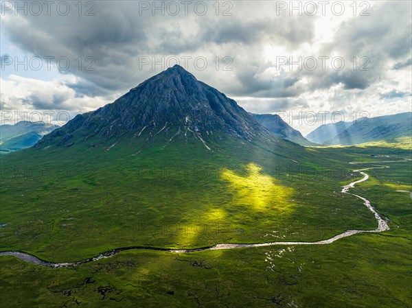 Sun Rays over The Buachaille or Buachaille Etive Mor and River Coupall from a drone