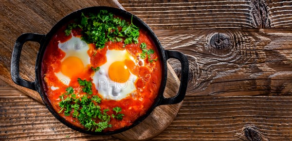 Shakshouka dish in a cast iron pan