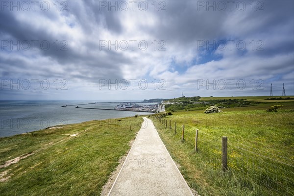 Footpath along the chalk cliffs of Dover with view to the ferry port