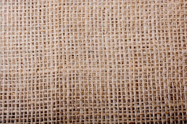 Brown color linen canvas as background texture