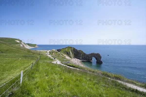 Walk along the chalk coast with the famous rock bridge Durdledoor