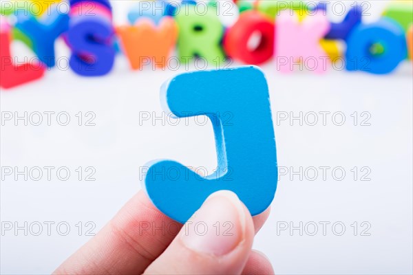 Letter cube of J of Alphabet made of wood