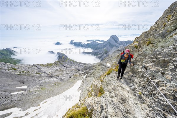 Mountaineer climbing Saentis over the Lisen ridge