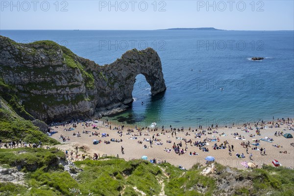 Bathing beach at the famous rock bridge Durdledoor