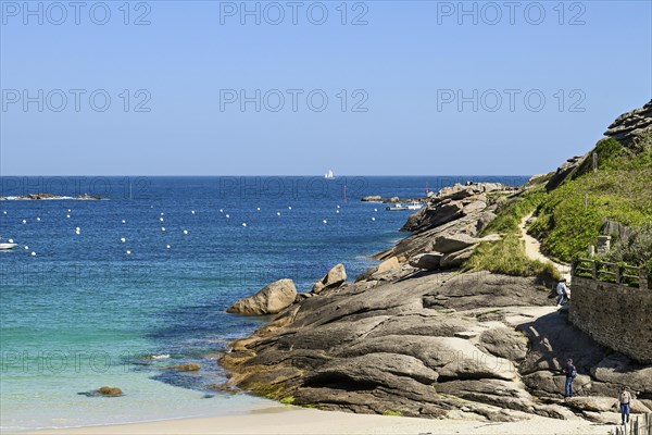 Bay with sandy beach and granite rocks