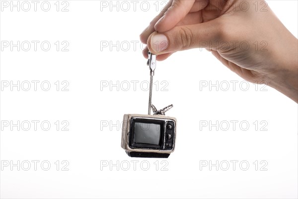 Child holding a tv set n his hand on a white background