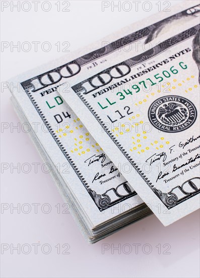 American 100 dollar banknotes made of paper placed on white background