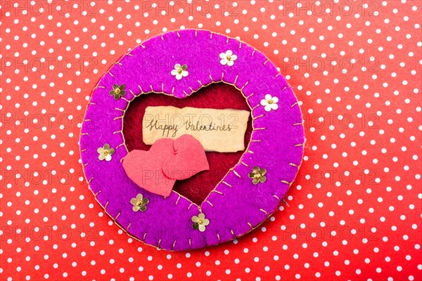 Love icon and Valentine's day wording on torn paper