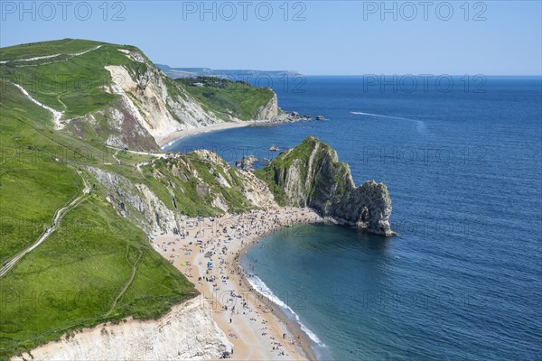 View over the chalk coast with the famous rock bridge Durdledoor