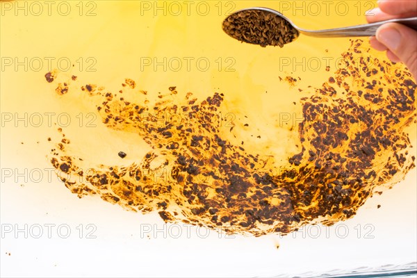 Coffe slowly dissolve in the hot water