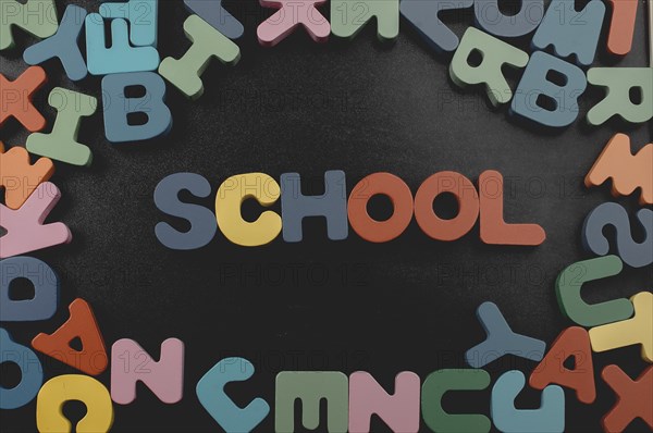Colorful Letters of Alphabet made of wood and school wording