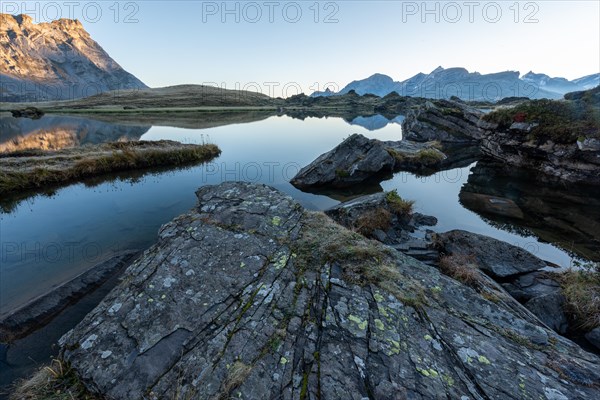 The Blue Lake at sunrise near Melchsee-Frutt on the Aa Alp in the Melch Valley