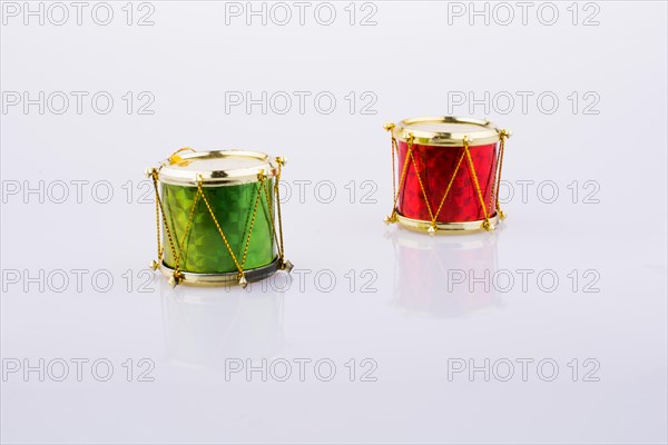 Two drums side by side on a white background