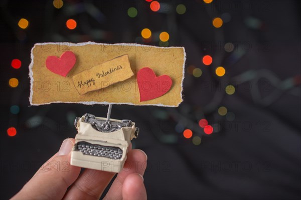 Valentine's day wording on torn typewriter as Love concept