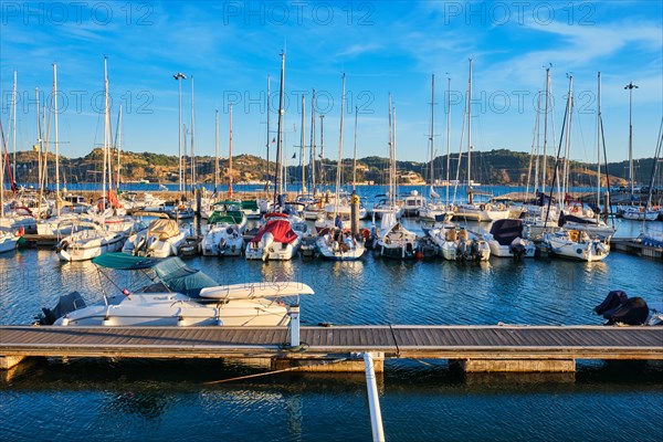 Lisbon marina on Tagus river with moored yachts and boats on sunset. Belem