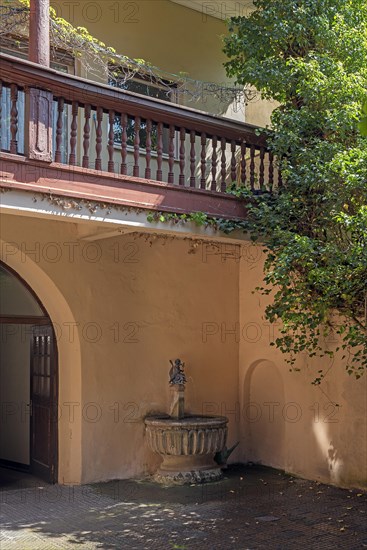 Copy of the historic Dolphin Rider Fountain in a courtyard