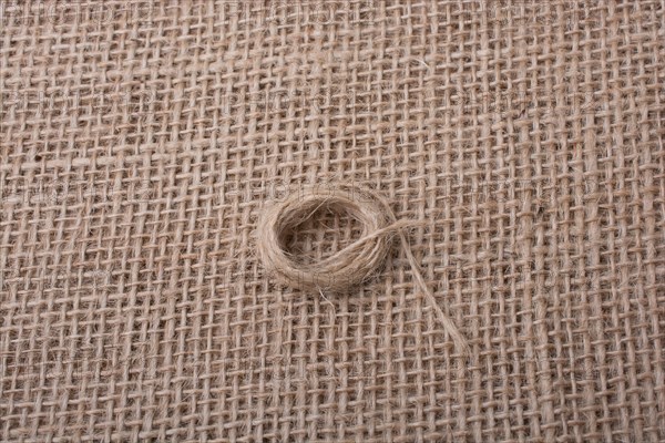 Roll of brown color linen string paper background