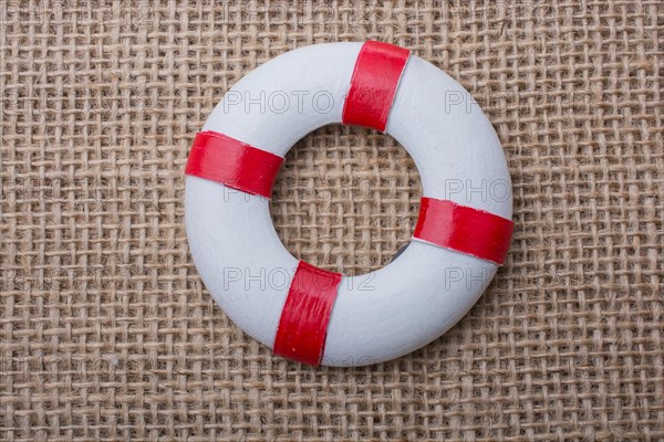 Lifesaver or life preserver on a fabric background