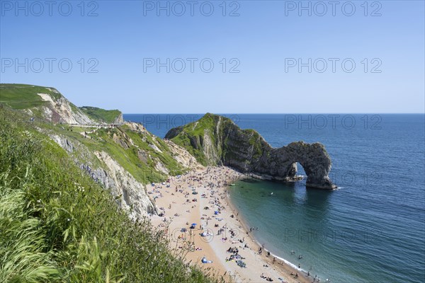 Bathing beach at the famous rock bridge Durdledoor