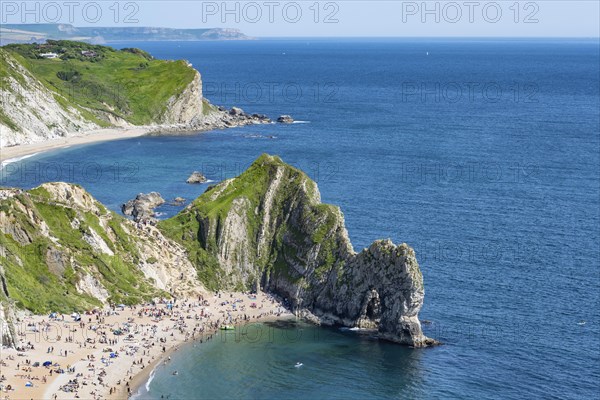 View over the chalk coast with the famous rock bridge Durdledoor