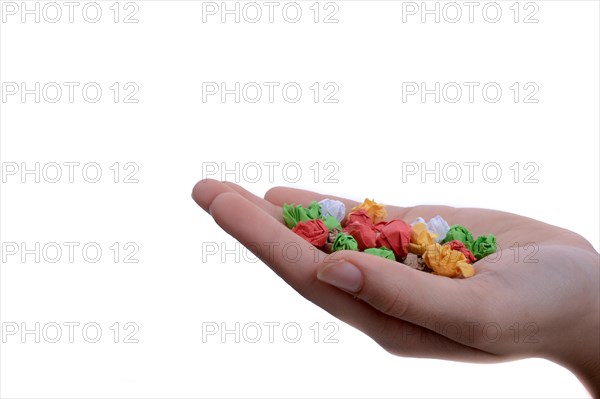 Handful crumpled colorful paper on a white background